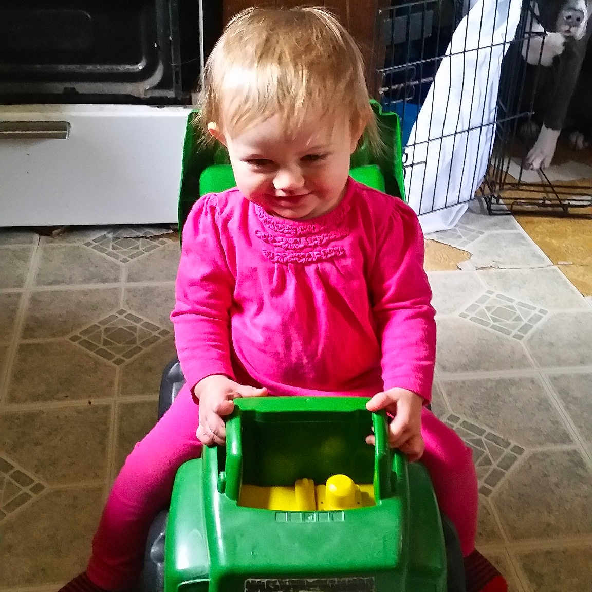 Marthua Carles is registered to the contest to win money with this photo: car, child, day, fun, green, infant, joy, person, play, product, sitting, toddler, toy