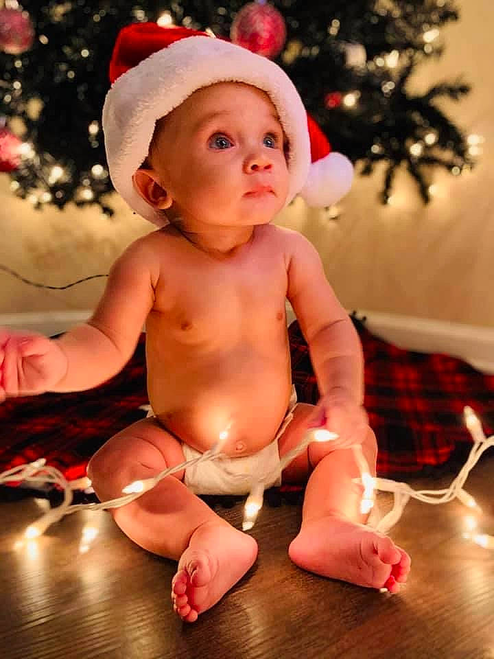 Maddix joined the competition — help win amazing prizes! abdomen, baby_toddler_clothing, barefoot, cheek, child, christmas, christmas_decoration, christmas_eve, costume_accessory, foot, holiday, human_body, mouth, muscle, nose, person, pink, sitting, skin, toddler