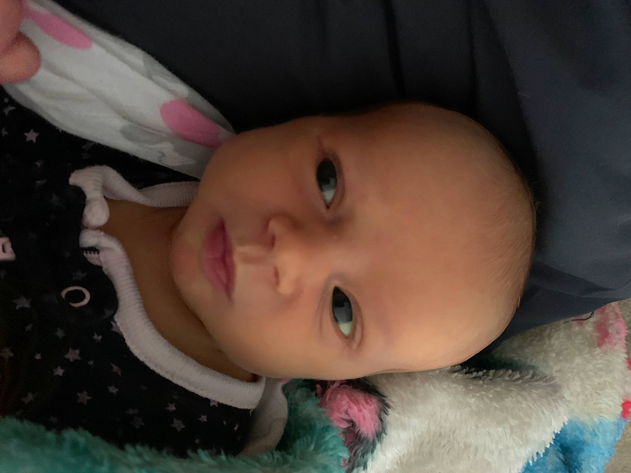 Alaska is registered to the contest to win money with this photo: baby, cheek, child, chin, close_up, ear, eye, eyebrow, face, forehead, head, iris, lip, mouth, nose, organ, person, pink, skin, smile