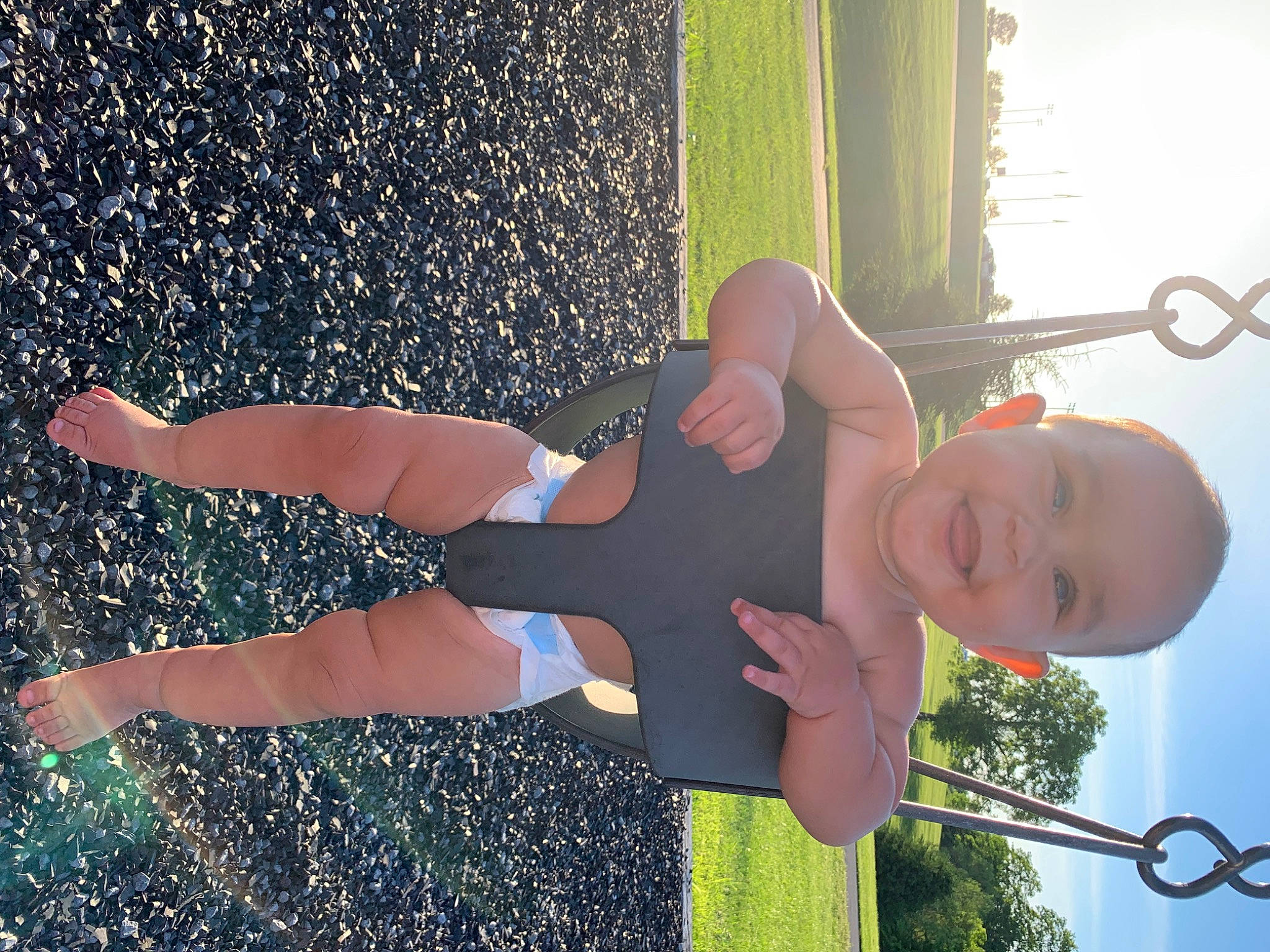 Lilah is registered to the contest to win money with this photo: arm, black, dress, facial_expression, hairstyle, hand, happy, human_body, joint, joy, leg, light, people_in_nature, person, photograph, plant, sky, sunlight, thigh, tree