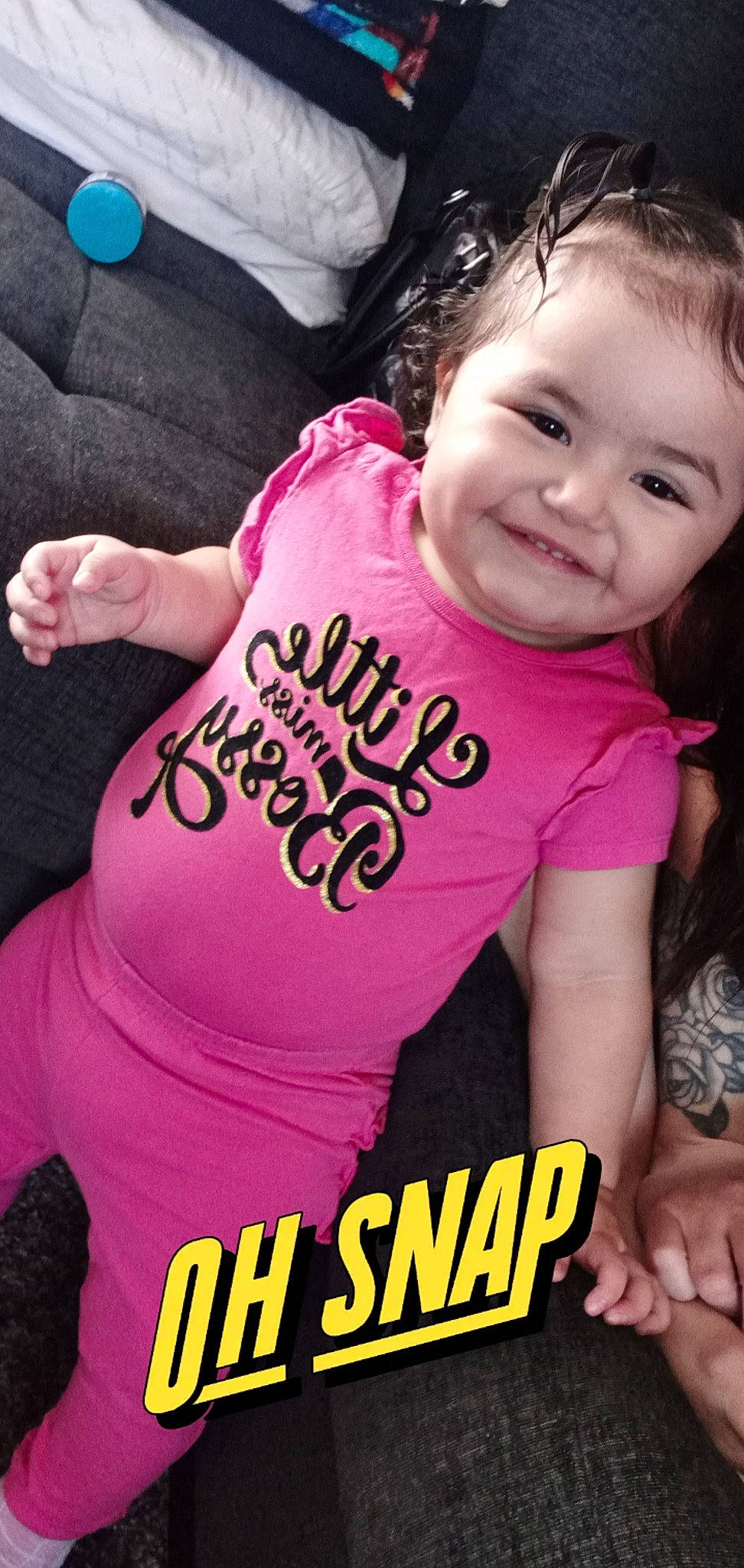 Koriee is registered to the contest to win money with this photo: arm, baby_toddler_clothing, beauty, child, cool, facial_expression, finger, font, gesture, hand, happy, joy, magenta, neck, person, pink, skin, sleeve, smile, t_shirt