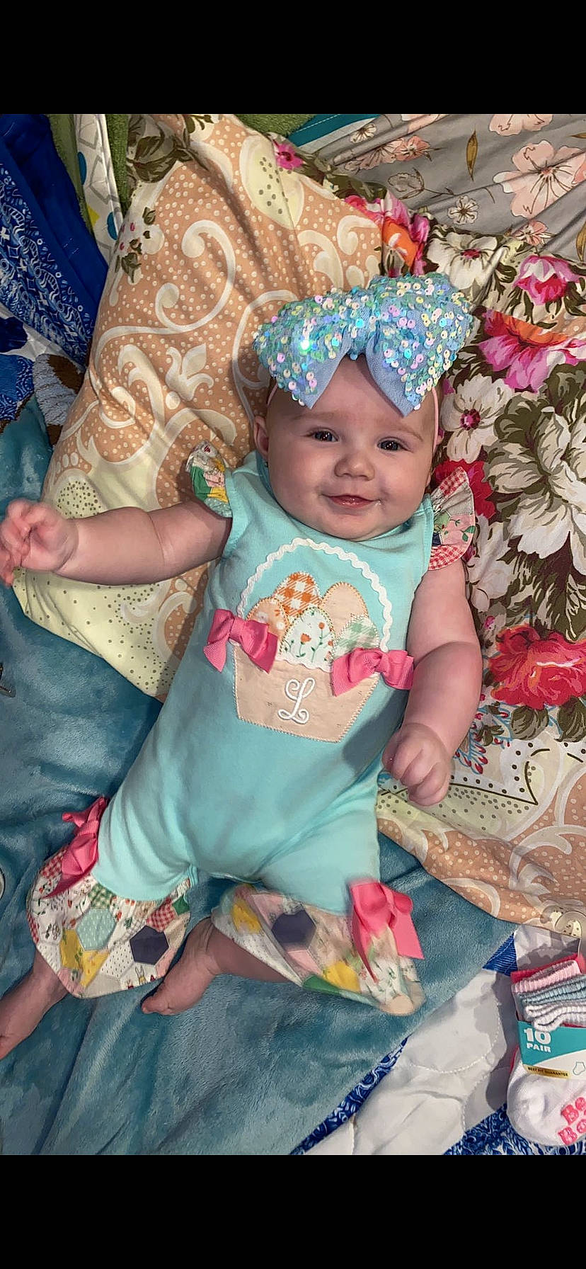 Lillie Jade is registered to the contest to win money with this photo: baby, baby_toddler_clothing, blue, cheek, child, costume_hat, event, eye, fashion_accessory, fun, happy, headpiece, headwear, iris, joy, linens, magenta, pattern, person, pink