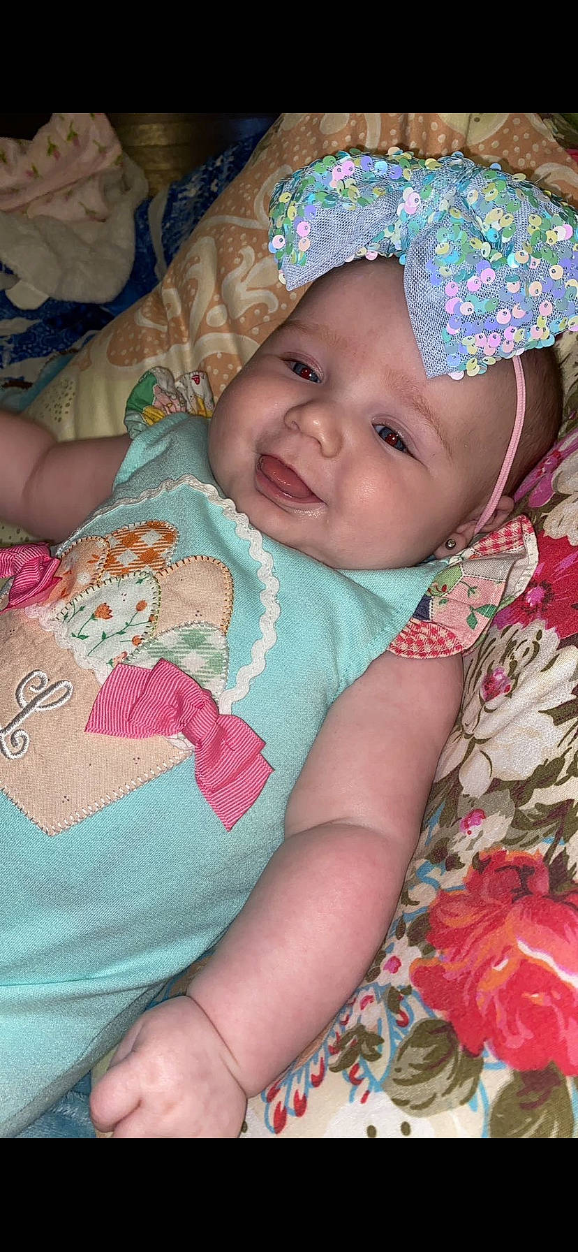 Lillie Jade is registered to the contest to win money with this photo: baby, baby_products, baby_toddler_clothing, cheek, child, comfort, event, eye, fun, happy, headwear, iris, linens, magenta, mouth, pattern, person, pink, skin, smile