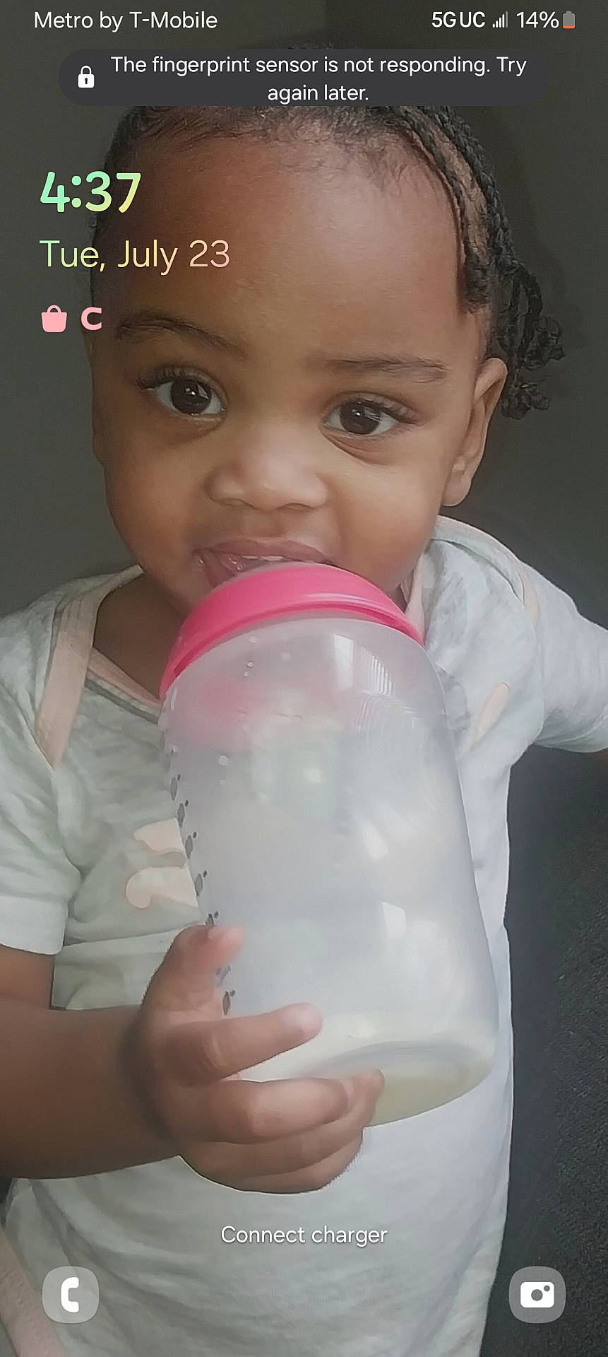 Johnnia is registered to the contest to win money with this photo: baby, beverage, bodypart, bottle, clothing, cup, dairy, drinking, face, finger, food, hand, head, jar, milk, newborn, person, photography, portrait, t_shirt