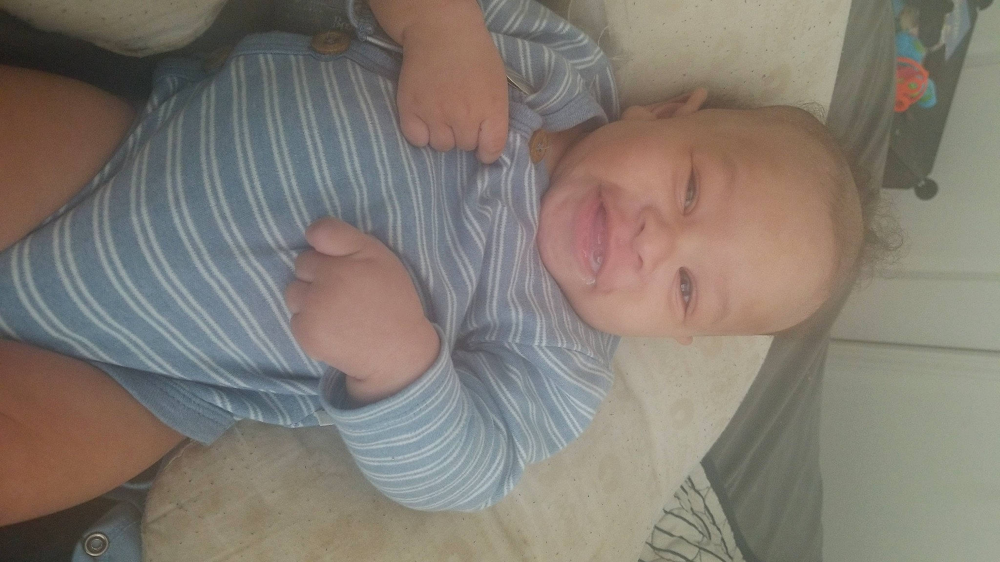 Zion is registered to the contest to win money with this photo: baby, baby_toddler_clothing, cheek, child, comfort, elbow, eyebrow, finger, foot, gesture, human_leg, iris, mouth, nose, person, skin, sleeve, smile, thigh, thumb