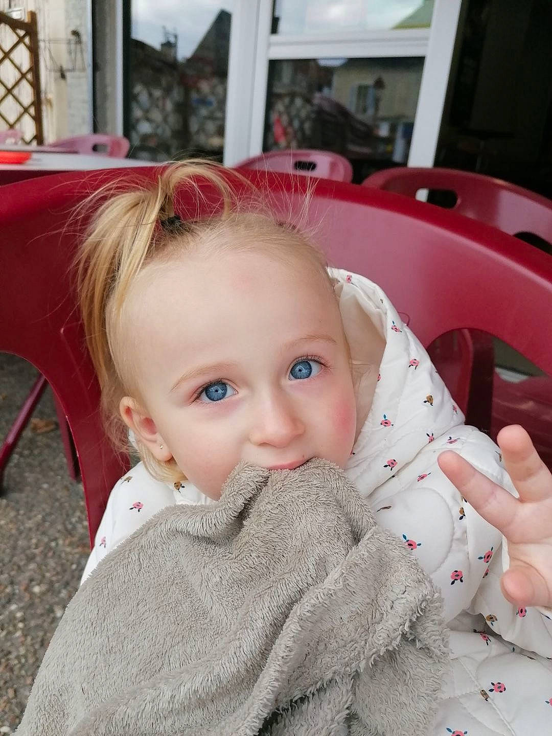 Lyana participe au concours pour gagner de l'argent avec cette photo : baby, baby_toddler_clothing, cheek, child, comfort, eyelash, flooring, fun, fur, happy, linens, lip, magenta, pattern, person, portrait_photography, sitting, skin, sleeve, smile