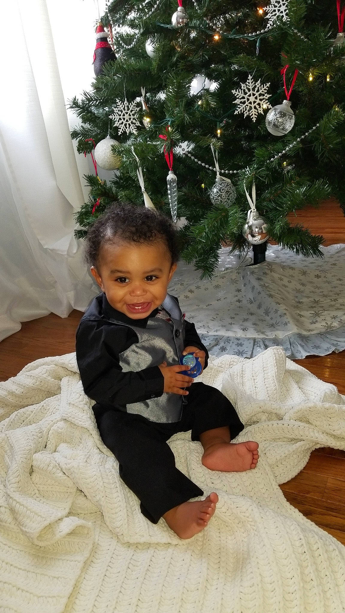 Euryah joined the competition — help win amazing prizes! child, christmas, christmas_decoration, christmas_ornament, christmas_tree, event, fun, girl, holiday, infant, person, plant, play, sitting, toddler, tree, vacation