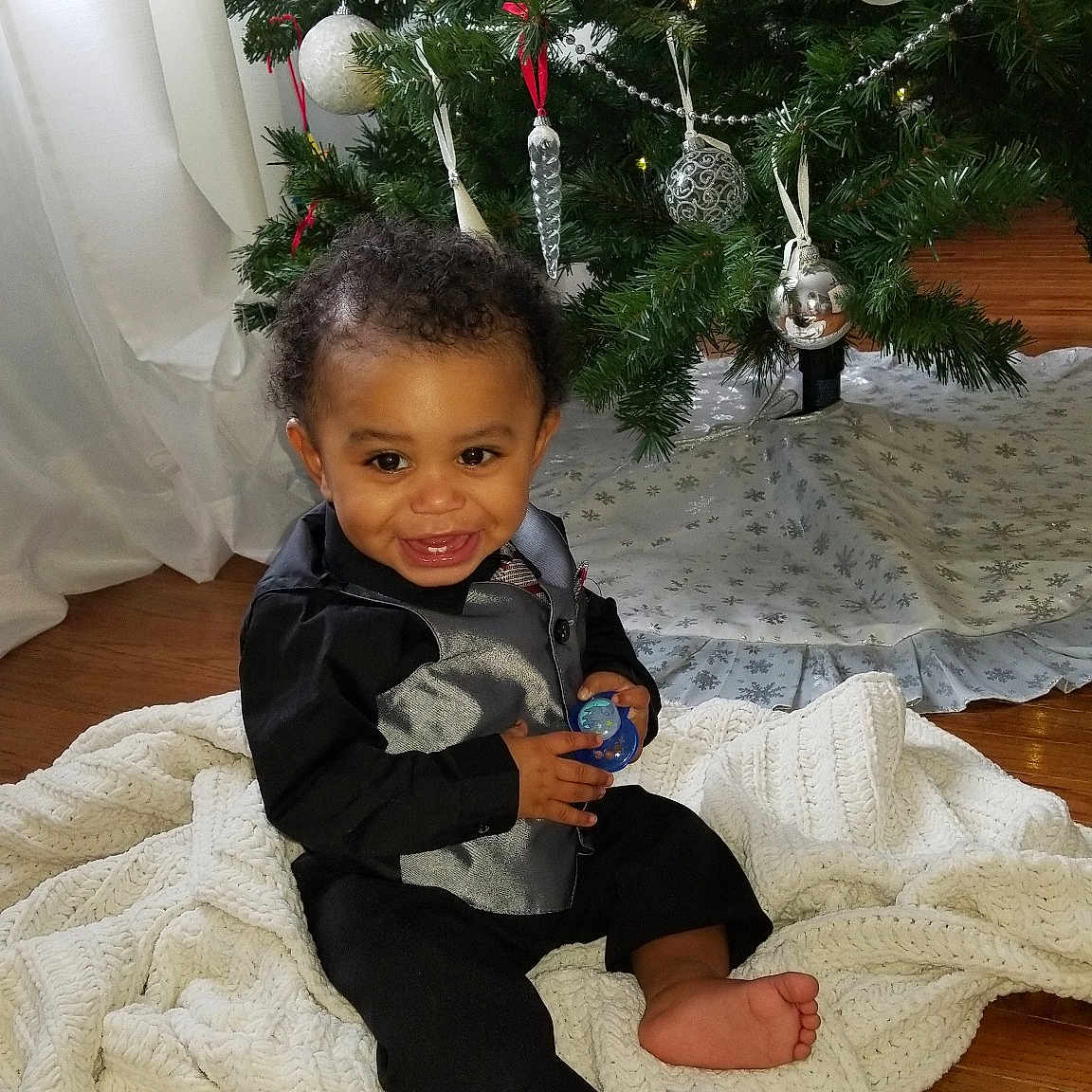 Euryah joined the competition — help win amazing prizes! child, christmas, christmas_decoration, christmas_ornament, christmas_tree, event, fun, girl, holiday, infant, person, plant, play, sitting, toddler, tree, vacation