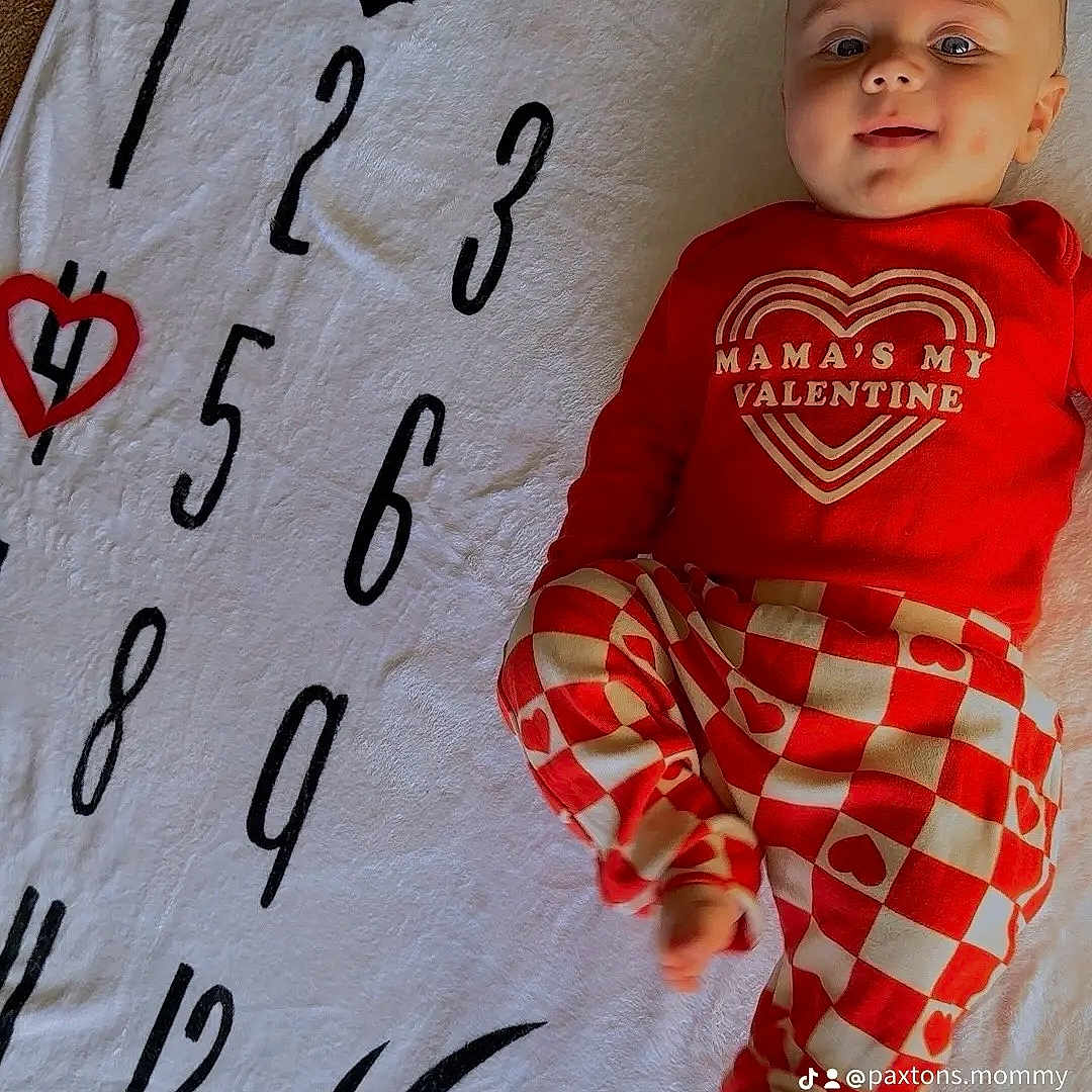 Paxton joined the competition — help win amazing prizes! accessories, applique, baby, banner, bed, bedroom, blanket, bodypart, calligraphy, clock, clothing, couch, crib, cushion, dress, face, finger, furniture, hand, handwriting