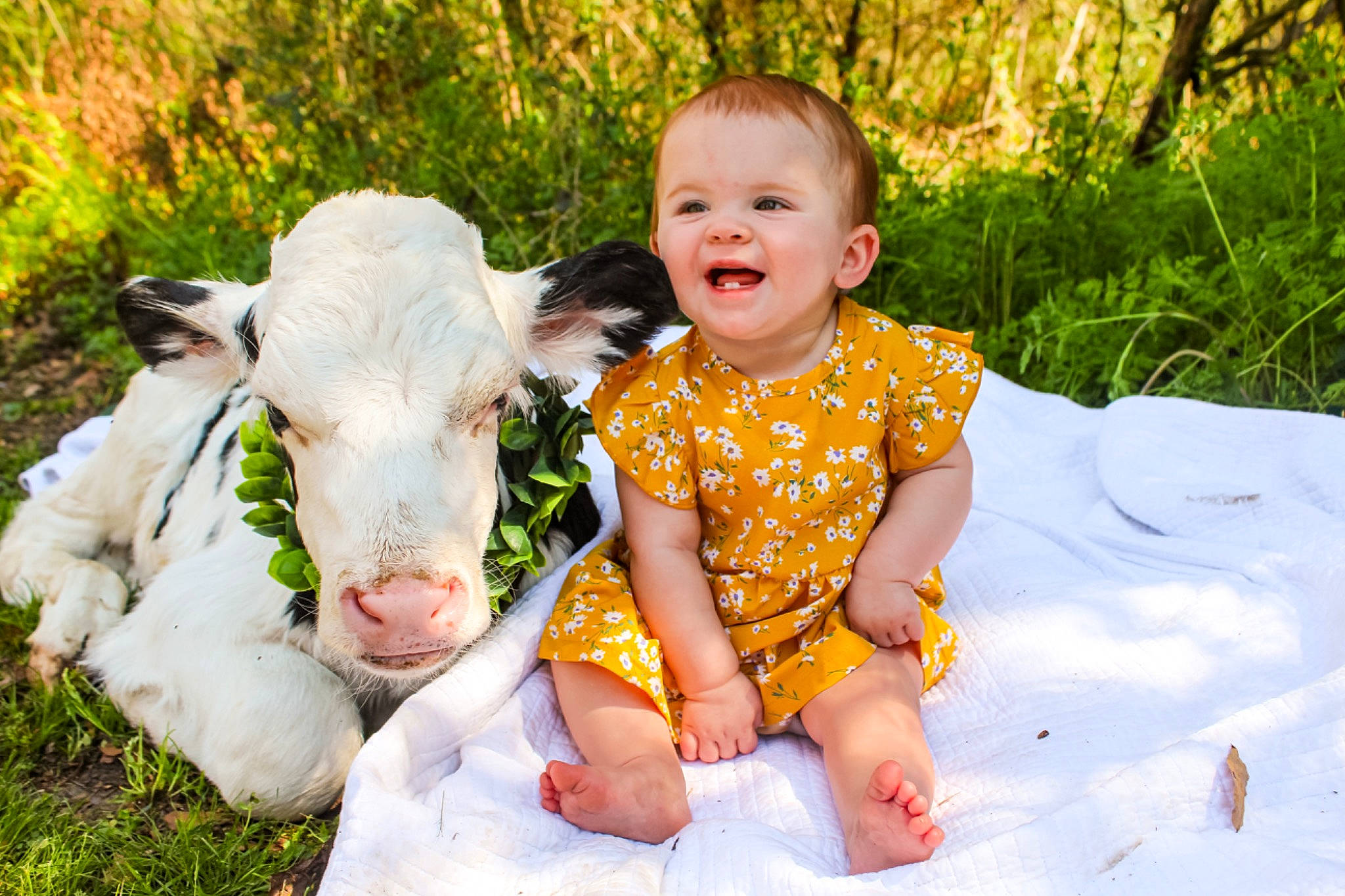 Emma is registered to the contest to win money with this photo: adaptation, baby_toddler_clothing, dress, eye, face, facial_expression, fawn, grass, happy, head, joy, leisure, meadow, people_in_nature, person, plant, skin, smile, summer, t_shirt