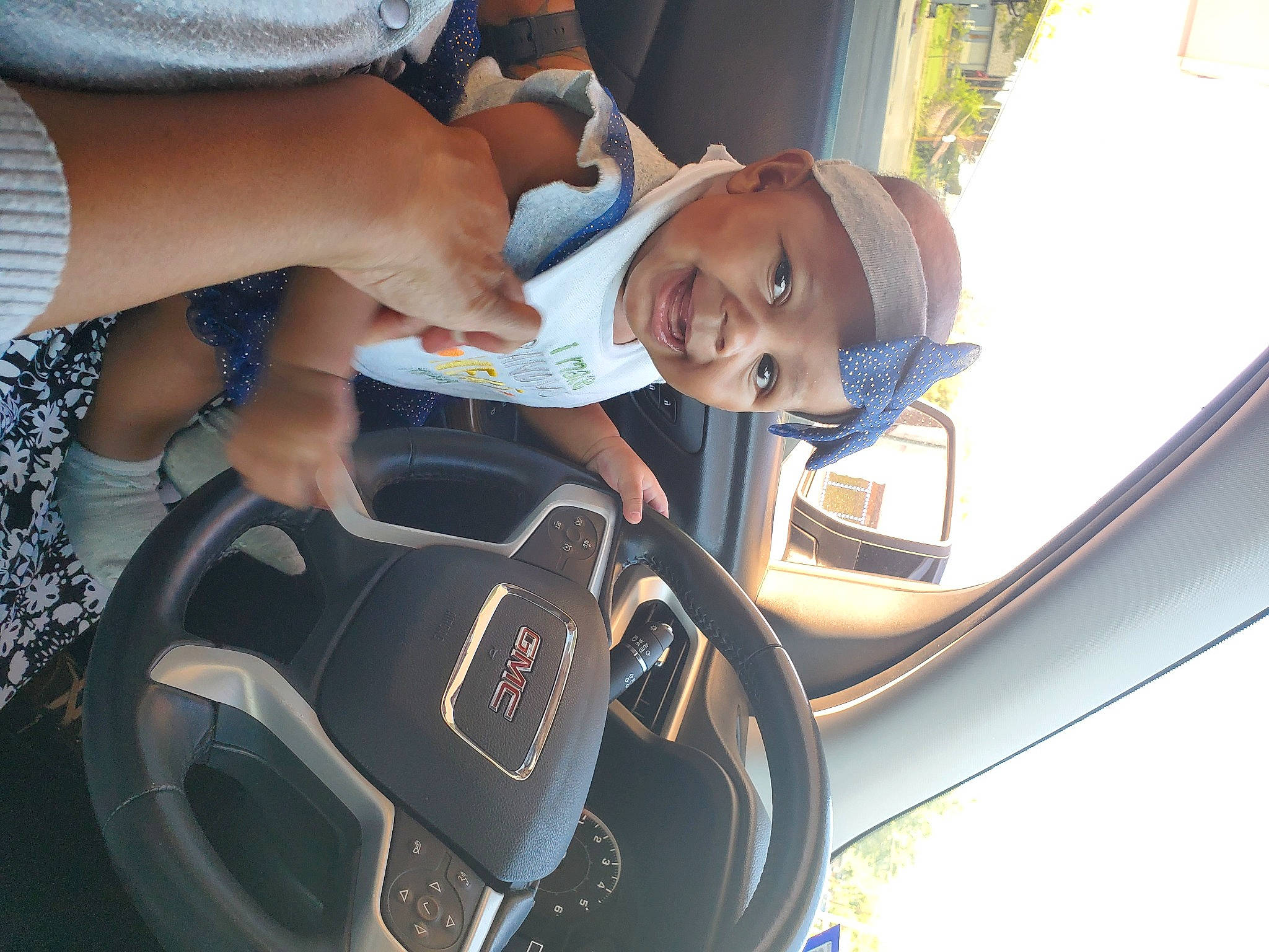 Alex'Zandria Wilson is registered to the contest to win money with this photo: auto_part, automotive_design, automotive_exterior, automotive_lighting, automotive_mirror, car, car_seat, car_seat_cover, family_car, gesture, happy, headwear, motor_vehicle, person, personal_luxury_car, plant, smile, steering_wheel, vehicle, vehicle_door