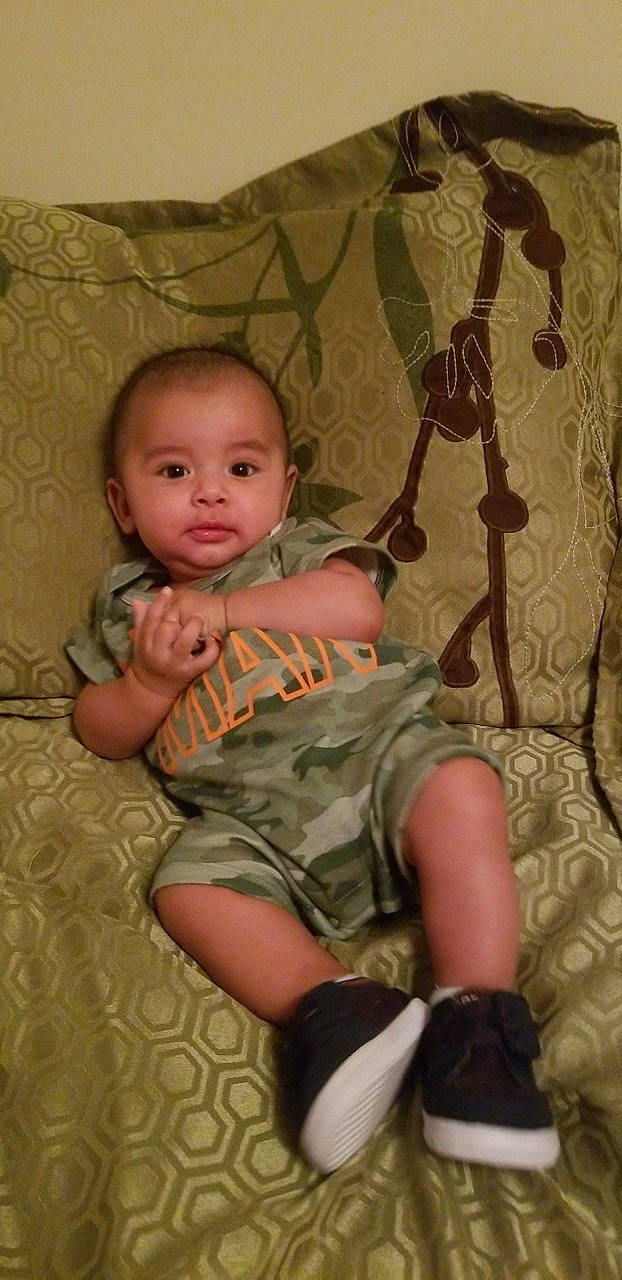 Dylan is registered to the contest to win money with this photo: child, finger, girl, infant, leg, person, product, sitting, skin, toddler