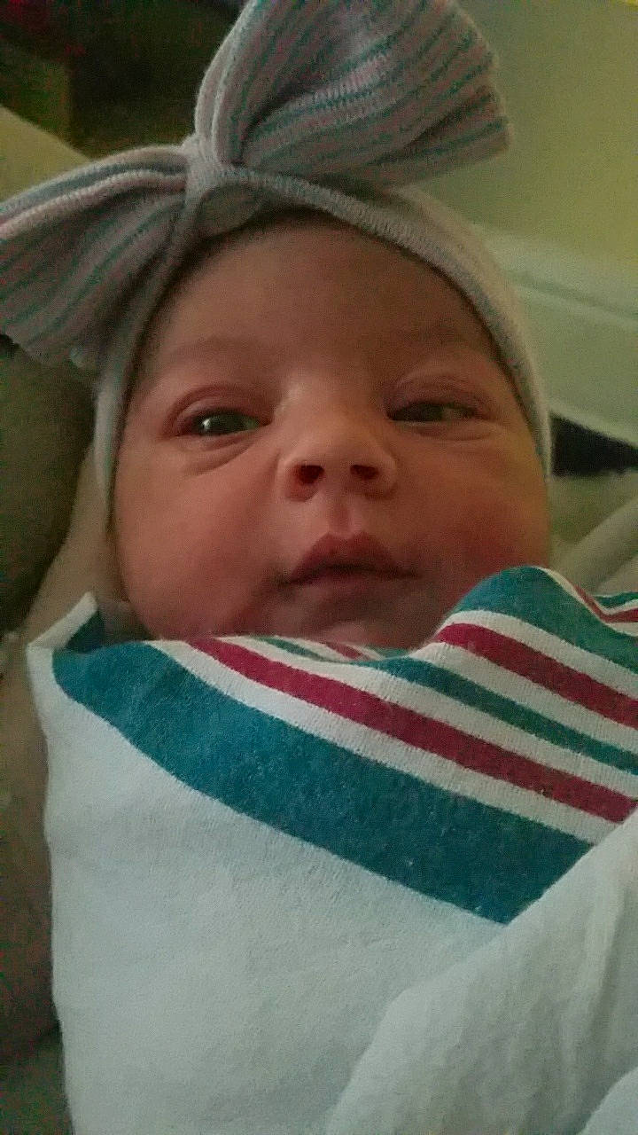 Melia is registered to the contest to win money with this photo: baby, baby_products, baby_toddler_clothing, bonnet, cheek, child, chin, costume_accessory, eye, eyebrow, eyelash, headwear, iris, linens, lip, nose, organ, person, skin, toddler