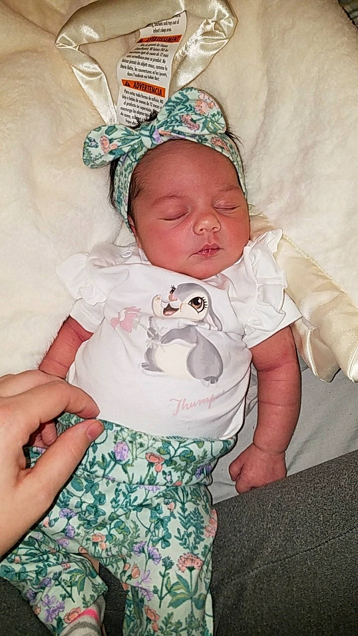 Melia joined the competition — help win amazing prizes! baby, baby_products, baby_toddler_clothing, bonnet, cheek, child, costume_accessory, hand, headband, human, linens, nail, pattern, person, pink, skin, toddler