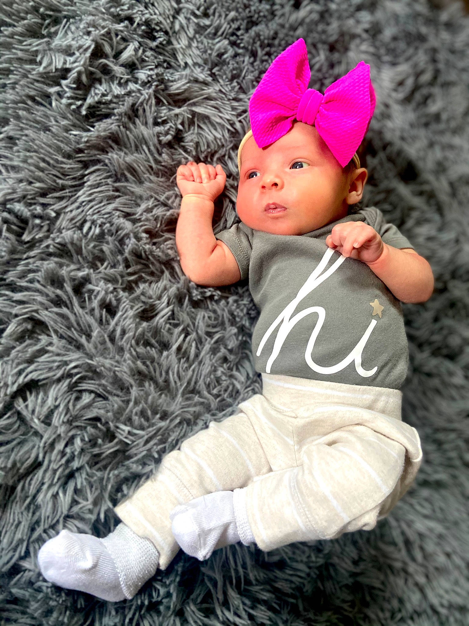 Brylee joined the competition — help win amazing prizes! baby, baby_toddler_clothing, cap, costume_hat, fur, grass, happy, headgear, knit_cap, outerwear, pattern, people_in_nature, pink, plant, sitting, sleeve, toddler, tree, winter, wool