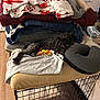 Sandy is registered to the contest to win money with this photo: blanket, clothing, crate, cushion, dog, furniture, gray, indoor, laying_down, pet, pile, red, relaxed, scruffy, sleeping_area, soft, texture, window_blinds, wood_floor, yellow
