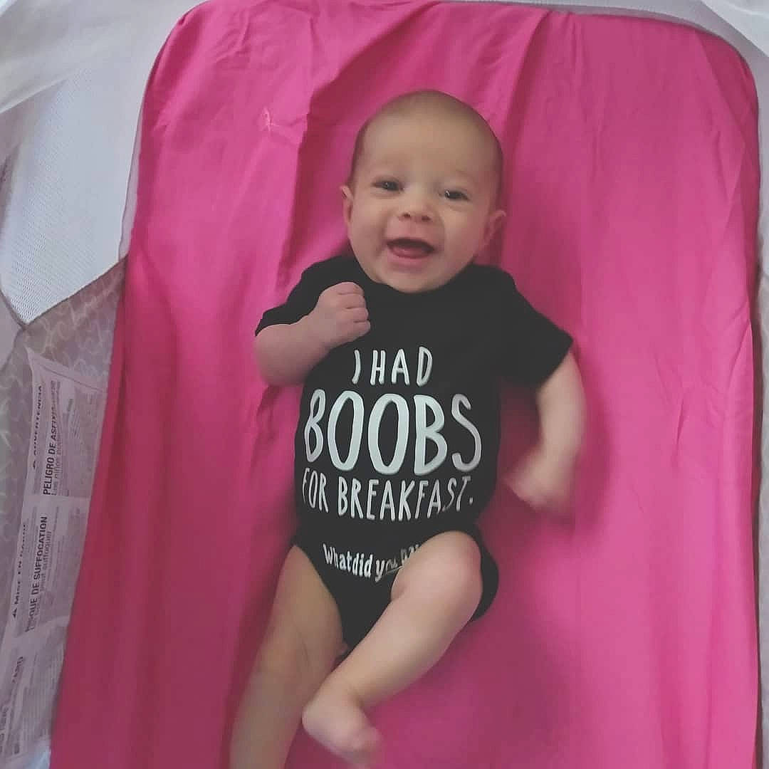 Waverlee is registered to the contest to win money with this photo: arm, baby, baby_safety, baby_toddler_clothing, cheek, comfort, cool, eye, face, finger, hand, happy, human_body, infant_bed, mouth, outerwear, person, pink, sleeve, smile