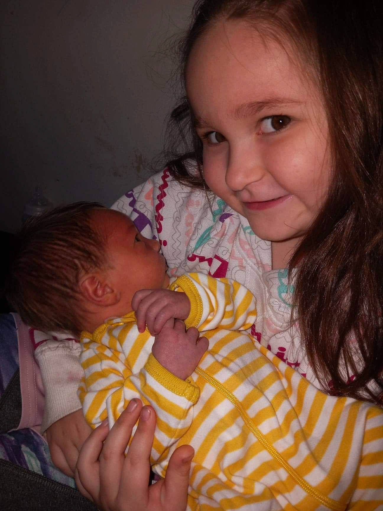 Amiya is registered to the contest to win money with this photo: baby, baby_toddler_clothing, cheek, child, chin, comfort, ear, finger, fun, gesture, happy, iris, lip, mouth, nose, person, sitting, skin, smile, thumb