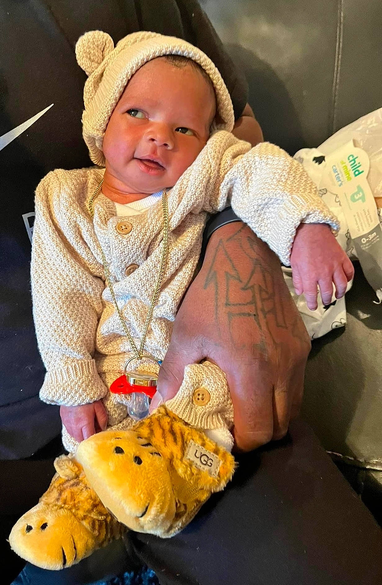 Amir is registered to the contest to win money with this photo: baby, baby_products, baby_toddler_clothing, beanie, butterfly, cap, child, comfort, fashion_accessory, happy, insect, knit_cap, linens, pattern, person, pollinator, sitting, skin, toddler, wool