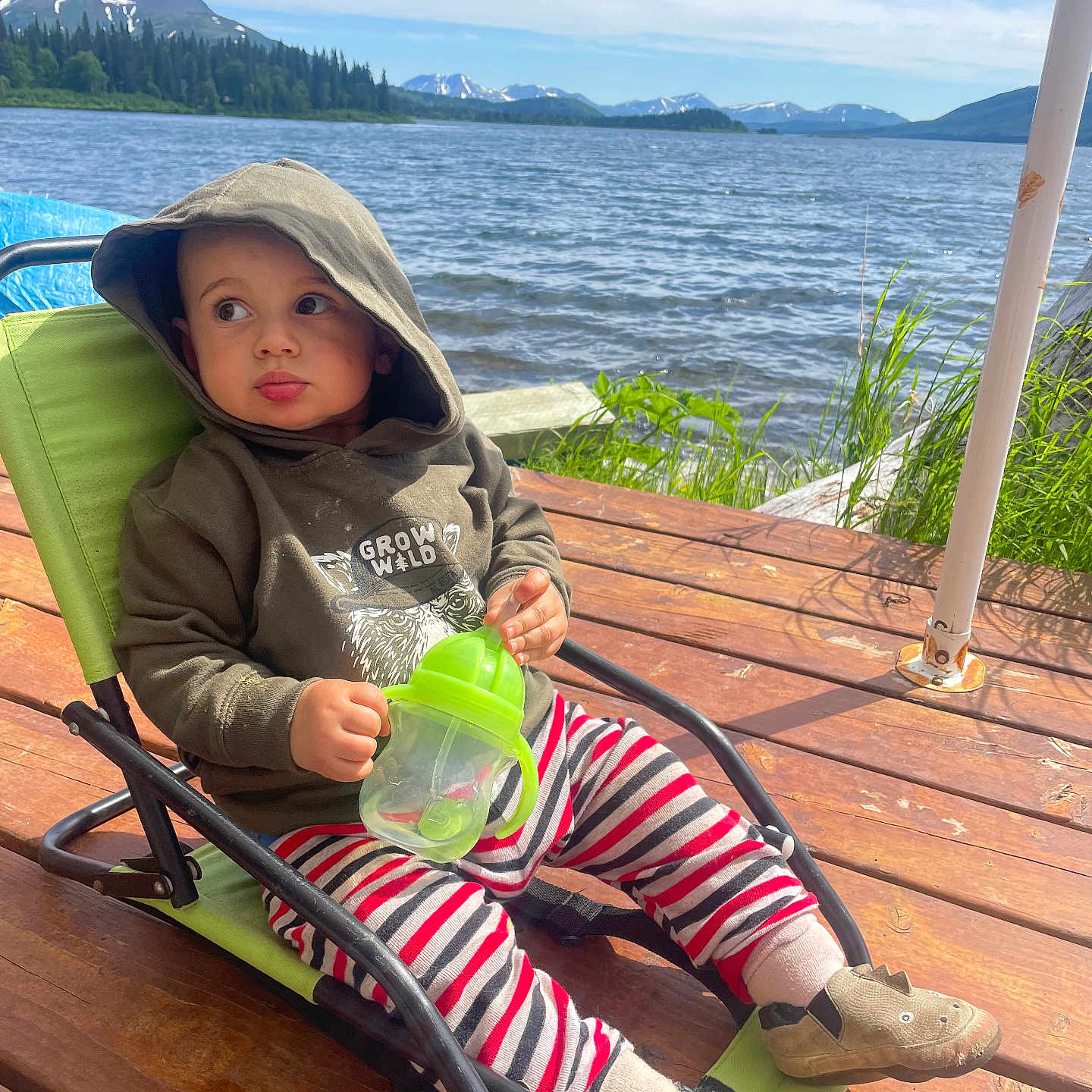 Remington is registered to the contest to win money with this photo: architecture, baby, building, face, head, house, housing, lake, nature, outdoors, person, photography, porch, portrait, shelter, sitting, summer, water, waterfront, wood