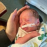 Xayla joined the competition — help win amazing prizes! newborn, baby, infant, sleeping, hand, blanket, hospital, nasal_tube, medical, person, face, wrapped, cute, fragile, child, treatment, healthcare, resting, indoor, gentle