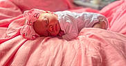 Xayla joined the competition — help win amazing prizes! baby, newborn, sleeping, pink, blanket, headband, bow, infant, soft, cozy, cute, peaceful, portrait, child, resting, indoors, fabric, closeup, toddler, face