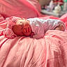 baby, newborn, sleeping, pink, blanket, headband, bow, infant, soft, cozy, cute, peaceful, portrait, child, resting, indoors, fabric, closeup, toddler, face
