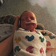 Xayla joined the competition — help win amazing prizes! newborn, baby, swaddled, blanket, hospital, nasal_tube, hand, sleeping, infant, medical, care, patient, cute, tiny, wrapped, person, healthcare, resting, indoor, soft_light