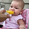 baby, child, cute, expression, feeding, floral_pattern, food, fruit, hand, high_chair, infant, outdoor, person, pineapple, pink, portrait, sitting, skin, striped_clothing, summer