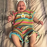 Madison joined the competition — help win amazing prizes! baby, smiling, colorful_clothing, headband, blanket, happy, infant, striped_outfit, crawling, cute, child, lying_down, portrait, indoors, soft_lighting, cheerful, young_child, skin, hands, feet