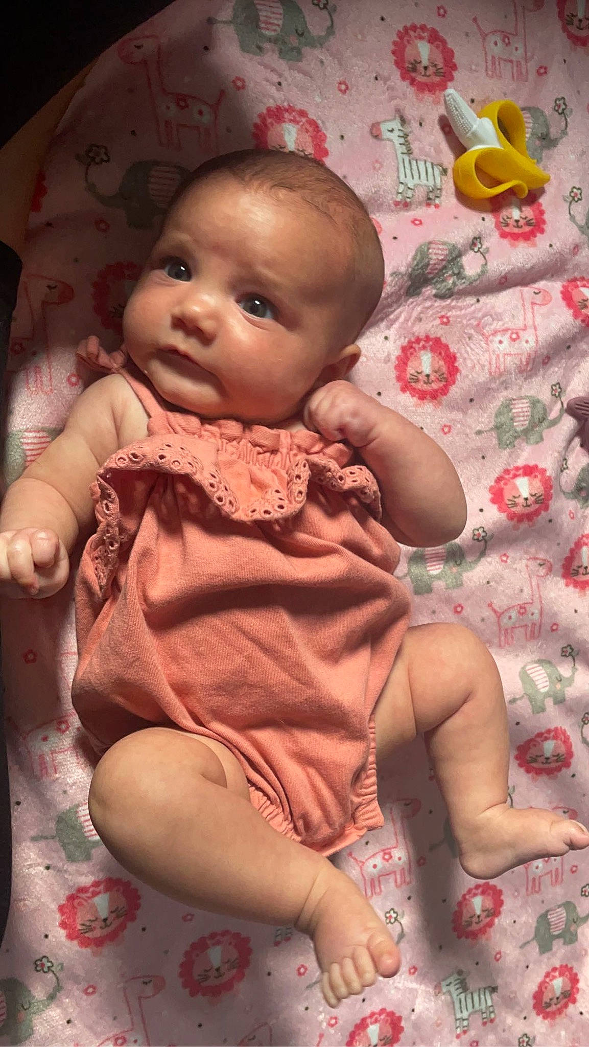 Ariah is registered to the contest to win money with this photo: baby, baby_products, baby_toddler_clothing, cheek, child, comfort, dress, finger, happy, human_leg, linens, nail, pattern, peach, person, pink, sitting, skin, sleeve, textile