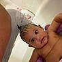 Maddison joined the competition — help win amazing prizes! baby, bath, bathtub, child, bath_seat, shampoo, water, tile_wall, soap_bottle, skin, earrings, bathroom, bath_time, cute, wide_eyes, expression, sitting, purple, person, indoor