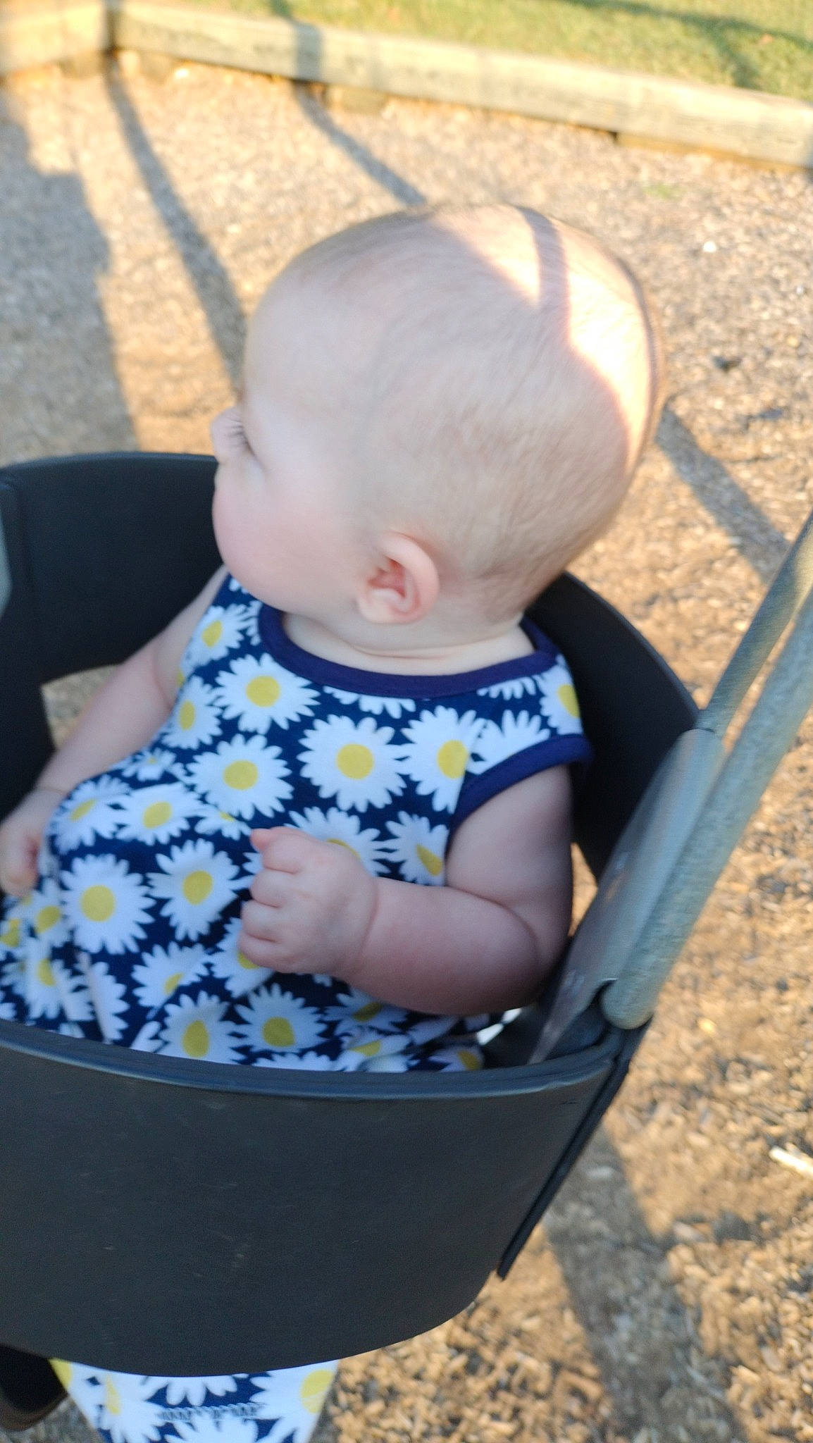 Dani is registered to the contest to win money with this photo: baby, baby_carriage, baby_products, baby_toddler_clothing, child, electric_blue, fun, grass, hairstyle, happy, head, leisure, pattern, person, play, product, recreation, sitting, skin, sleeve