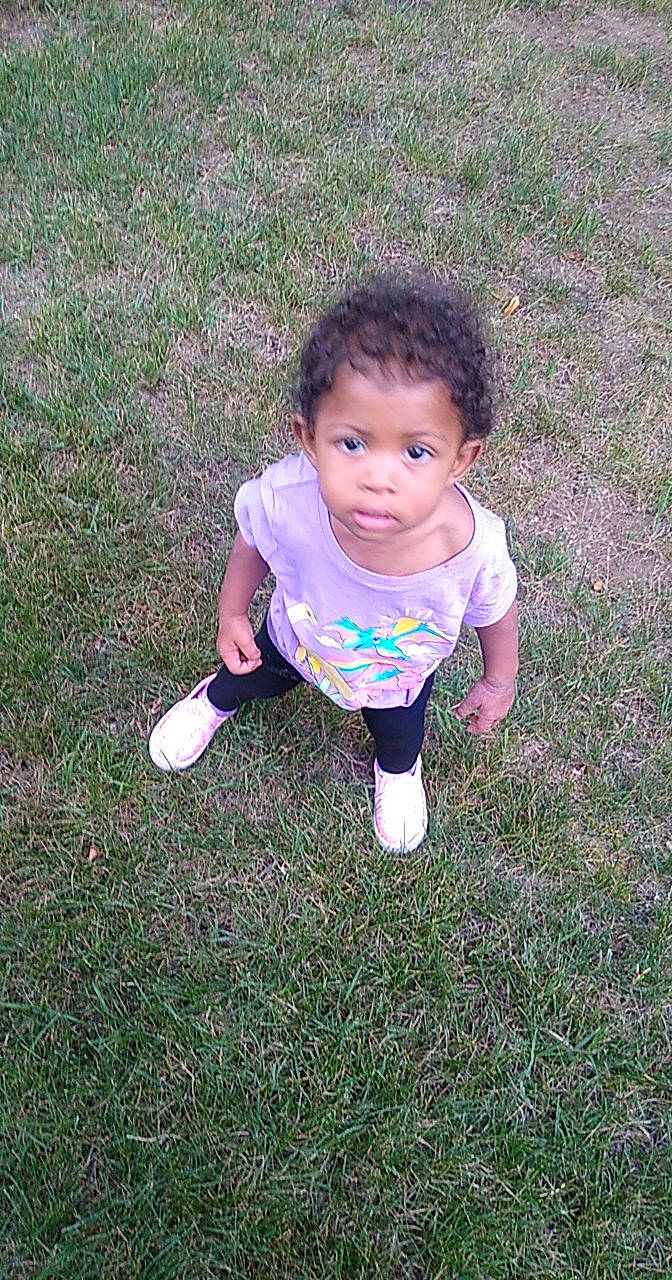 Ella Rose is registered to the contest to win money with this photo: baby, baby_toddler_clothing, cheek, child, electric_blue, eye, fun, grass, grass_family, grassland, happy, lawn, magenta, mammal, pattern, people_in_nature, person, plant, play, sleeve