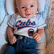 Derecho joined the competition — help win amazing prizes! baby, infant, child, cubs_shirt, denim_jeans, smiling, face, head, eyes, hand, cushion, baby_seat, clothing, comfortable, cute, portrait, happy, indoor, casual, young