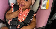 Journei joined the competition — help win amazing prizes! baby, child, car_seat, headband, smile, infant, safety_harness, cute, pink, clothing, white_socks, seat_belt, portrait, happy, indoor, person, car, baby_girl, fashion, accessory