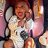Journei joined the competition — help win amazing prizes! baby, child, car_seat, pink_headband, onesie, polka_dot, smiling, happy, infant, toddler, plush_toy, teddy_bear, sunlight, shadow, seat_belt, close_up, cute, indoor, person, clothing
