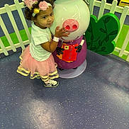 Melrose is registered to the contest to win money with this photo: accessories, baby, bracelet, child, clothing, costume, face, female, footwear, girl, glove, hat, head, helmet, indoors, jewelry, person, photography, portrait, shoe