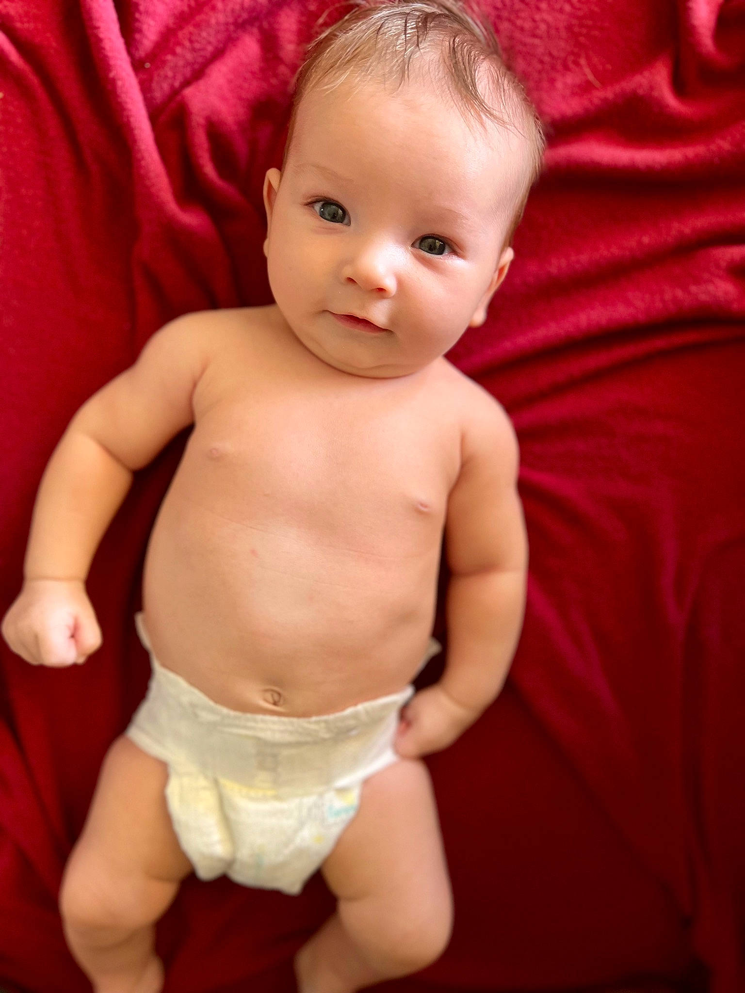 Owen is registered to the contest to win money with this photo: baby, baby_toddler_clothing, cheek, chin, eye, face, finger, head, human_body, iris, leg, lip, muscle, organ, person, pink, skin, smile, stomach, thigh