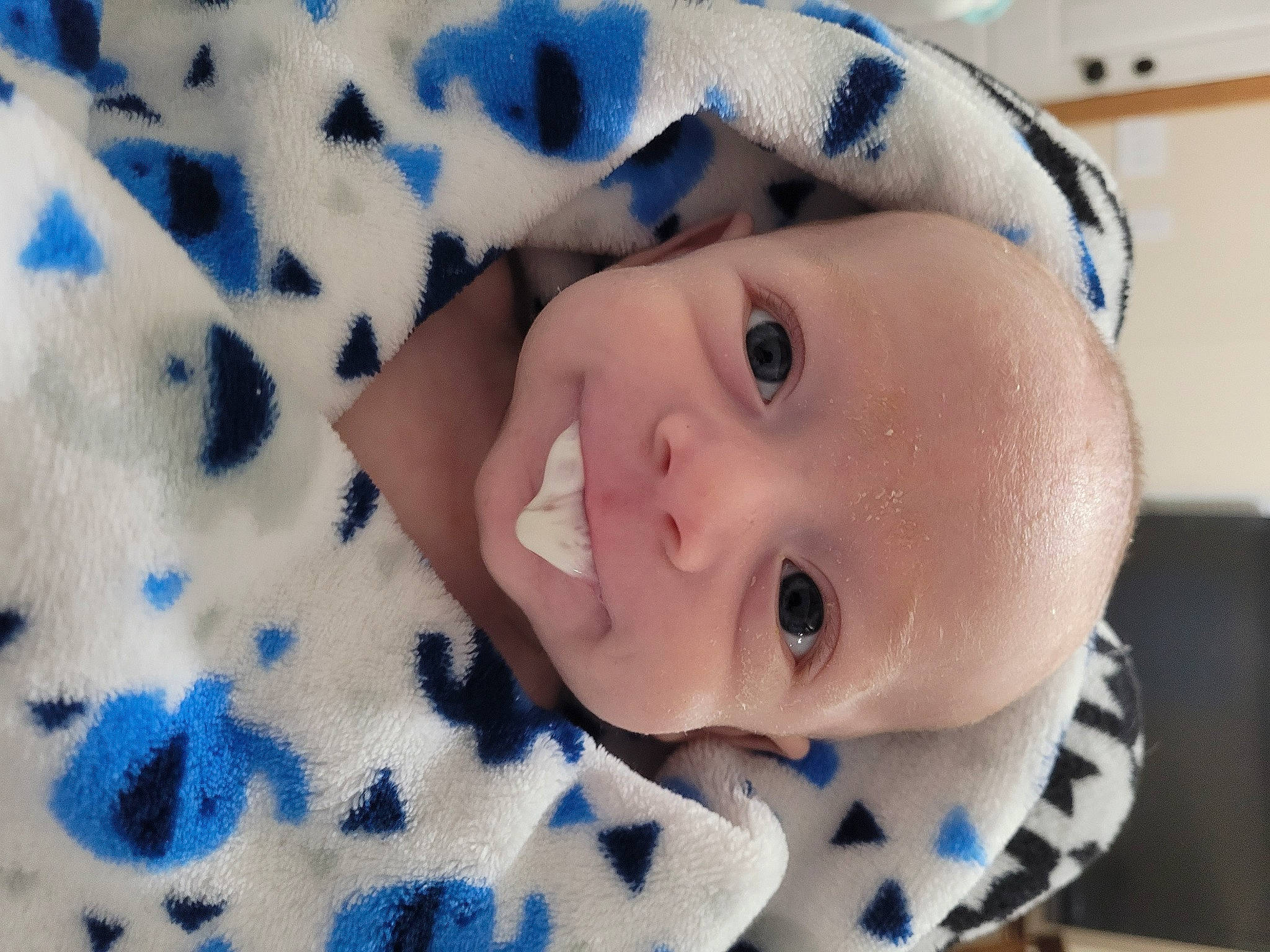 Scott is registered to the contest to win money with this photo: azure, baby, baby_toddler_clothing, blue, cheek, child, chin, electric_blue, eyebrow, eyelash, happy, iris, linens, lip, nose, pattern, person, skin, sleeve, smile