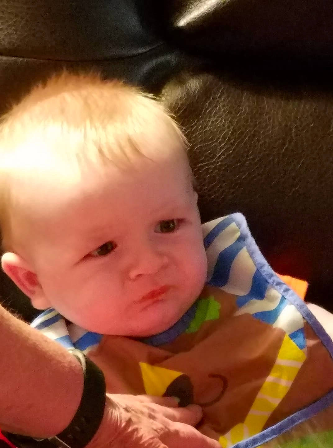 Slade is registered to the contest to win money with this photo: baby, beauty, cheek, child, chin, ear, eye, face, finger, forehead, head, iris, lip, mouth, nose, person, sitting, skin, thumb, toddler