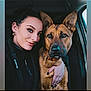 woman, dog, german_shepherd, selfie, car, pet, companion, portrait, smile, black_hair, earrings, piercing, collar, seat, window, hand, animal, friendship, indoors, casual