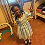 Nyla joined the competition — help win amazing prizes! child, girl, smiling, peace_sign, blue_dress, white_tights, black_shoes, curly_hair, bedroom, bunk_bed, carpet, window, curtains, playful, indoor, happy, pose, person, youth, home