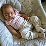 Nova joined the competition — help win amazing prizes! baby, sleeping, infant, pink_shirt, text_on_clothing, baby_rocker, patterned_fabric, gray_pants, socks, cute, peaceful, indoors, soft_lighting, child, person, portrait, resting, comfort, cushion, cozy