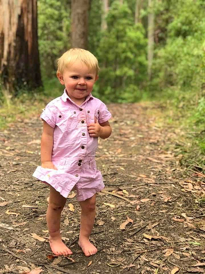 Indy joined the competition — help win amazing prizes! adaptation, blond, child, child_model, forest, fun, grass, joy, jungle, people, person, photography, pink, plant, play, portrait, smile, soil, standing, toddler