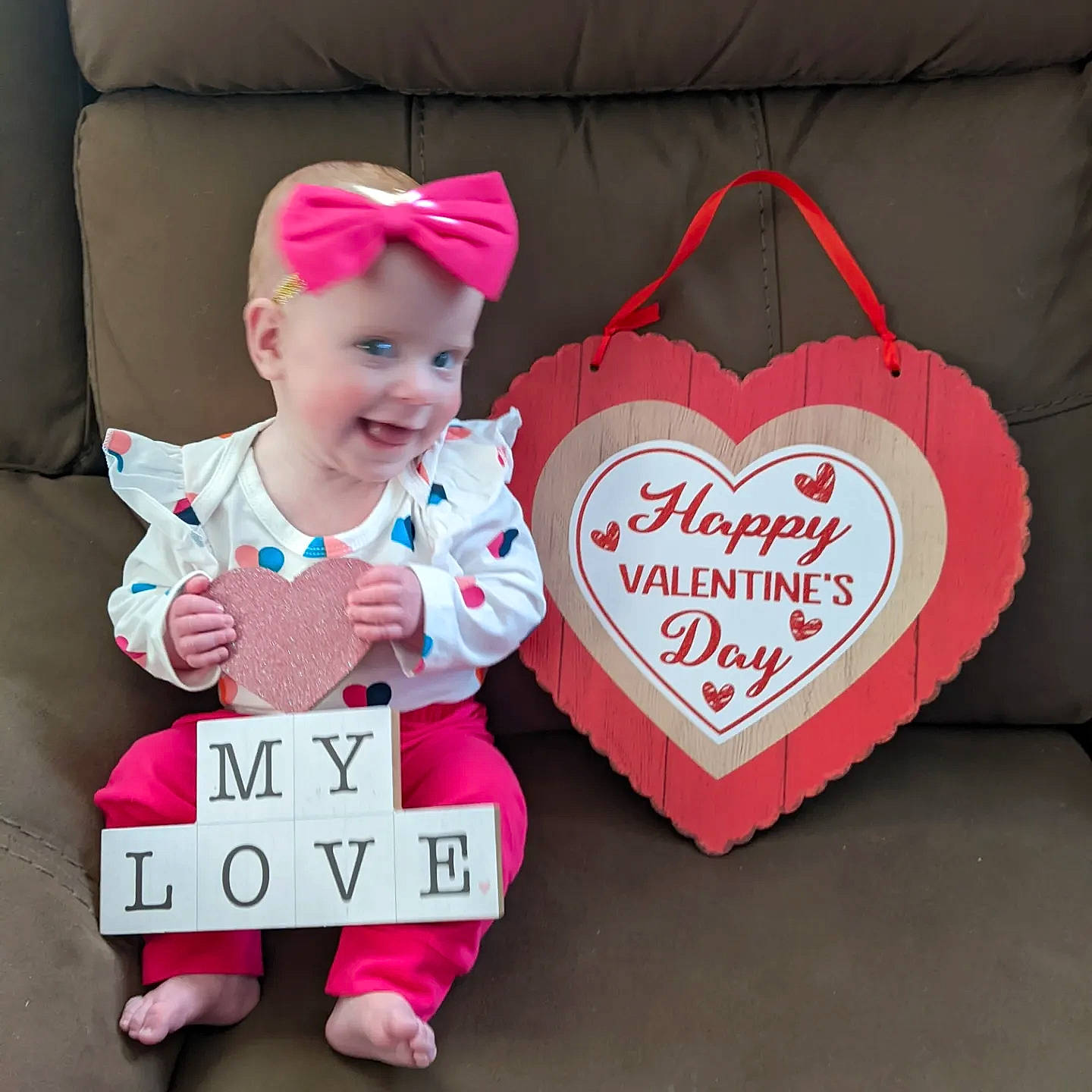 Ruby is registered to the contest to win money with this photo: baby, baby_toddler_clothing, carmine, costume_hat, event, fashion_accessory, font, happy, headwear, heart, holiday, joy, magenta, party_supply, pattern, person, pink, product, sleeve, smile