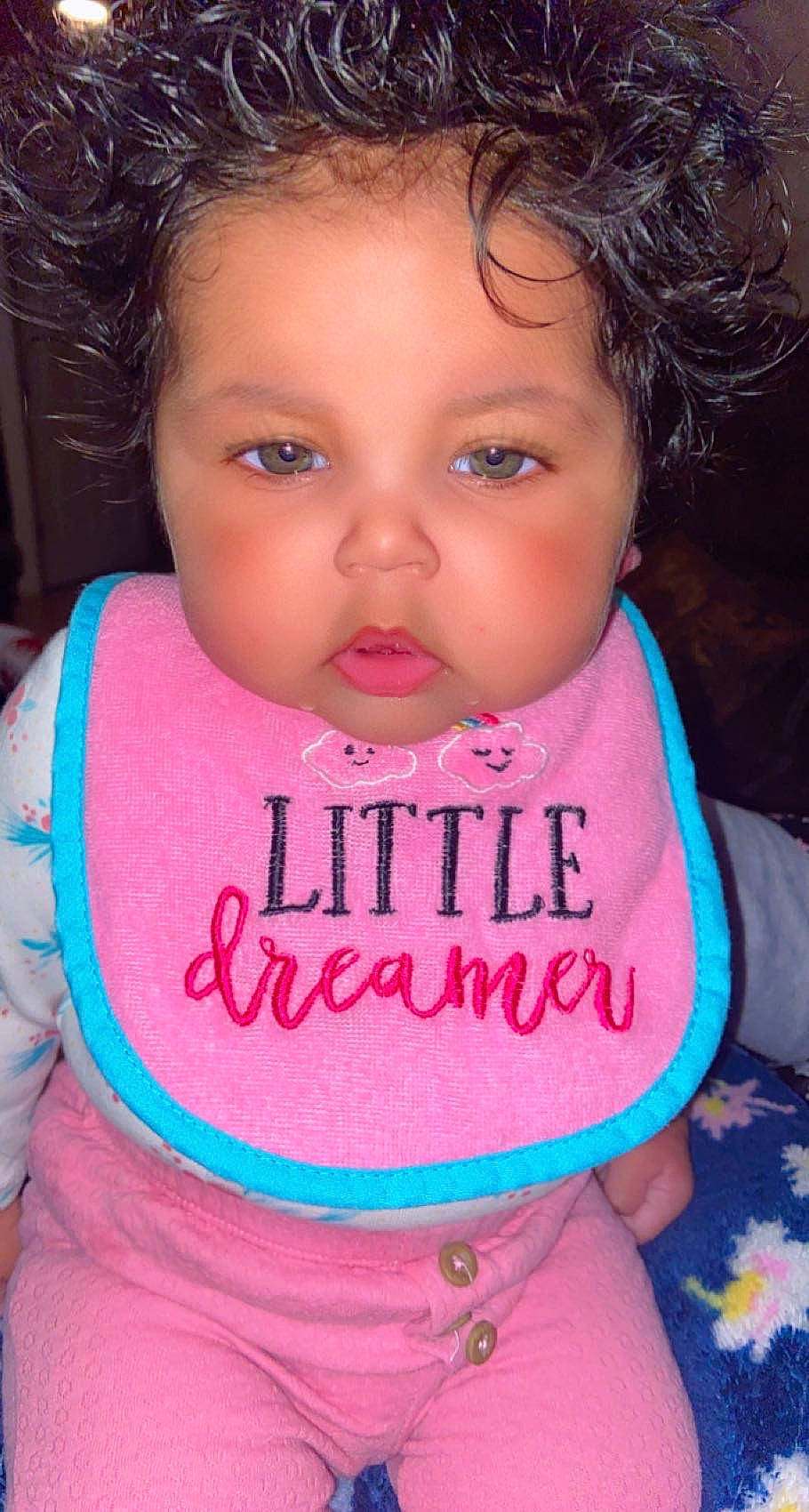 Alianna is registered to the contest to win money with this photo: baby_toddler_clothing, black, cheek, chin, eye, eyebrow, eyelash, face, facial_expression, forehead, hair, hairstyle, head, lip, mouth, neck, nose, organ, person, product