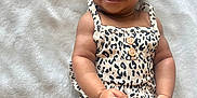 Harper joined the competition — help win amazing prizes! baby, blanket, button, child, clothing, cute, face, fashion, hand, happy, headband, indoors, infant, leopard_print, lying_down, person, portrait, skin, smiling, young