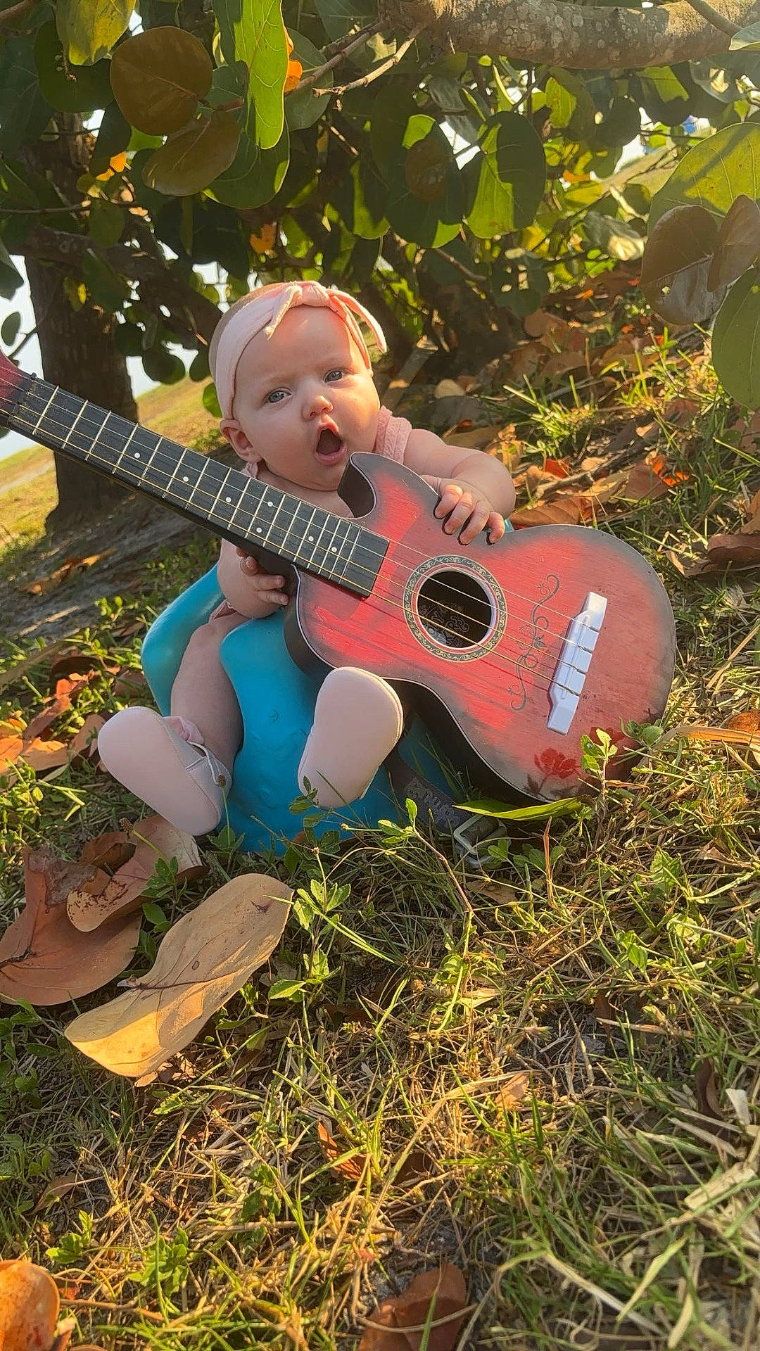 Benelli Raven is registered to the contest to win money with this photo: clothing, costume, face, grass, guitar, head, herbal, herbs, musicalinstrument, nature, outdoors, park, person, photography, plant, portrait, pottedplant, soil, summer, vegetation