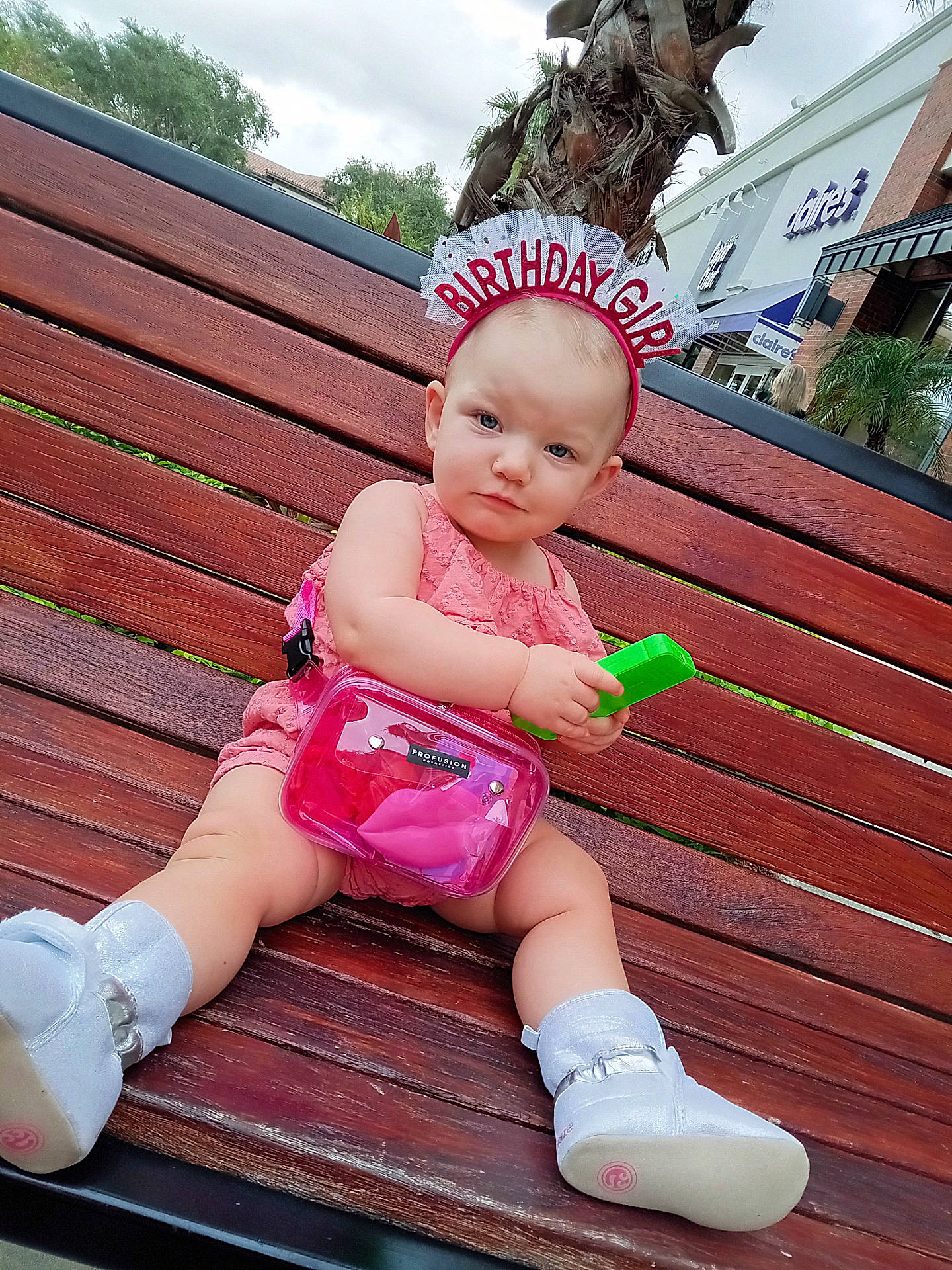 Beretta is registered to the contest to win money with this photo: baby, bench, bodypart, cap, clothing, face, finger, footwear, furniture, hand, hardwood, hat, head, person, photography, portrait, shoe, shorts, sitting, wood